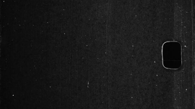Vintage 16mm film frame overlay with dust, scratches, and sprocket hole texture