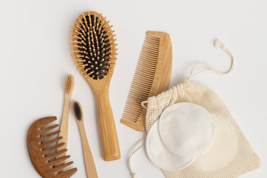 Eco friendly organic beauty products mockup with bamboo brushes, combs and cotton pads