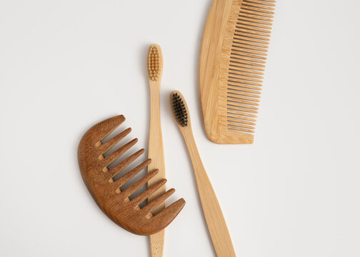 Eco friendly bamboo toothbrushes and wooden combs for sustainable daily routine