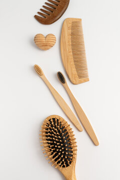 Eco friendly bamboo toothbrushes and wooden combs for sustainable daily routine
