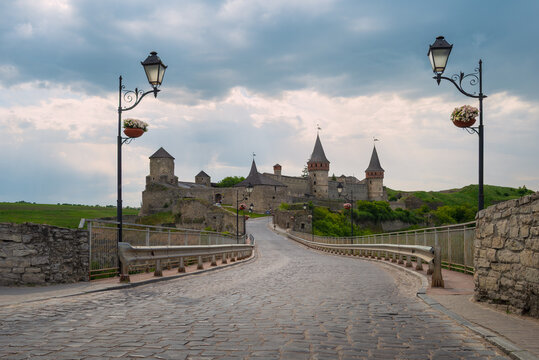 Historic cobblestone bridge leading to the medieval Kamianets-Podilskyi castle fortress, Ukraine