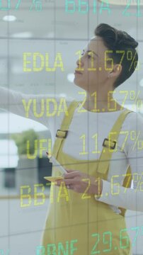 Animation of financial data processing over diverse business people having meeting at office