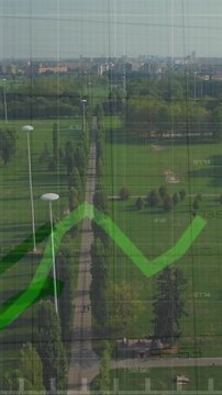 Animation of statistical data processing against aerial view of grassland
