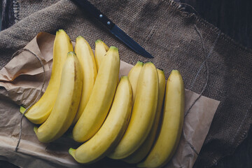 Fresh bananas on the dark background © Thai