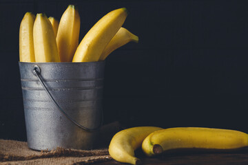 Fresh bananas on the dark background © Thai