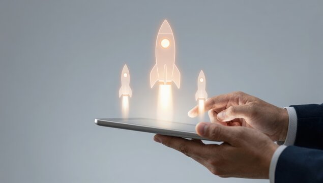 Startup rocket launch hologram rising from tablet in businessman hands, symbolizing business growth, innovation strategy, digital transformation, project success and technology development concept.