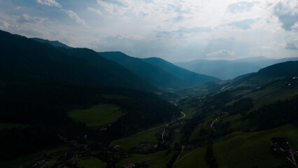 Obraz premium Majestic scenery of rough mountain ridge near grassy hills 