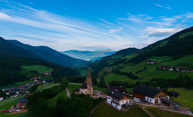Obraz premium Landscape village Santa Maddalena in mountain valley at sunset in Dolomites, Italy. St. Magdalena and mountains. Val di Funes 