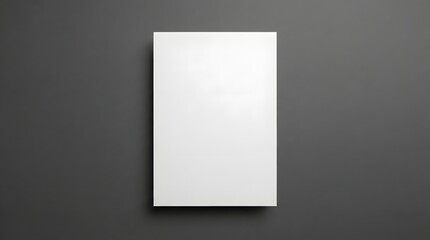 Fototapeta premium Empty blank white paper frame mockup on dark gray backdrop for design templates and presentations