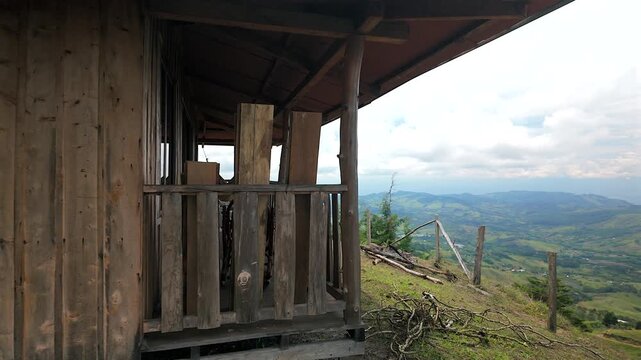 wooden cabin porch overlooking colombia mountain valley landscape