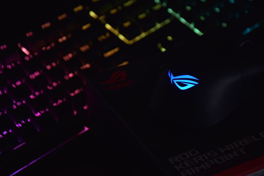 Asus rog keris wireless aimpoint gaming mouse on a dark background.