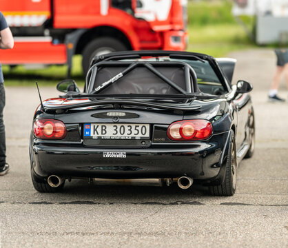 Kristiansand, Norway - June 14 2026: Black Mazda MX5 roadster rear view at automotive meet.