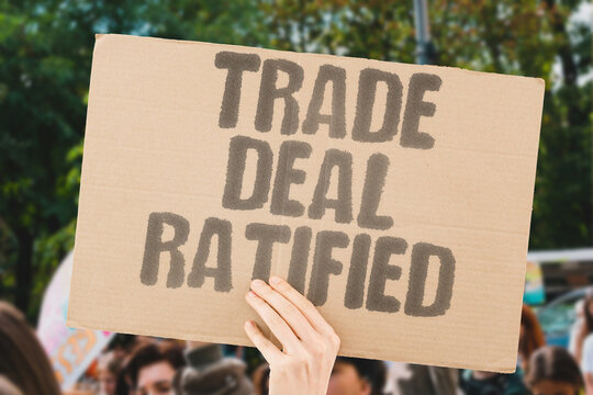 "Trade Deal Ratified" A trade deal is ratified by the parliament. TRADE. DEAL. RATIFIED. PARLIAMENT. APPROVAL.