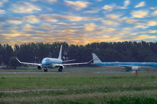 July 30, 2026. Netherlands, Amsterdam. KLM Passenger Plane on Runway at Schiphol Sunset