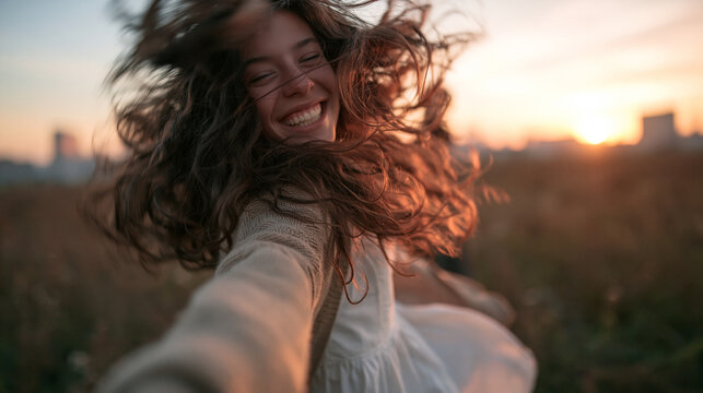 Happy Young Woman Spinning Outdoors During Golden Hour Sunset