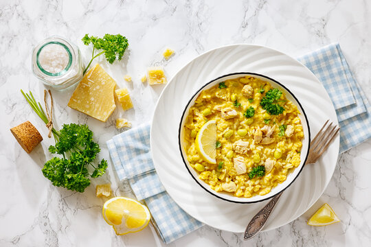 Chicken risotto with edamame beans, parsley, lemon