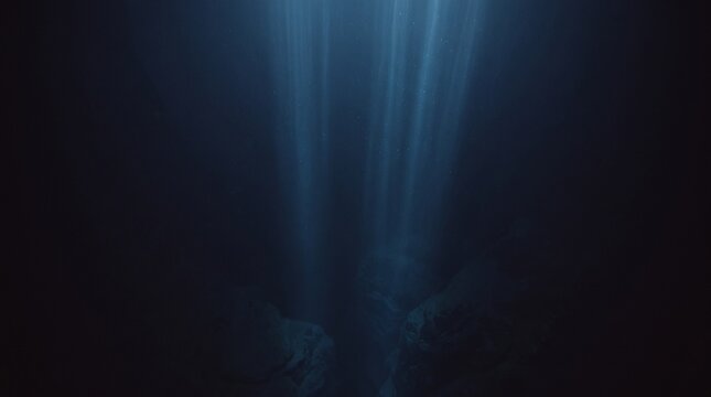 Deep ocean water with ethereal light rays penetrating darkness creating mysterious underwater atmosphere