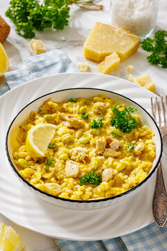 Chicken risotto with edamame beans, parsley, lemon