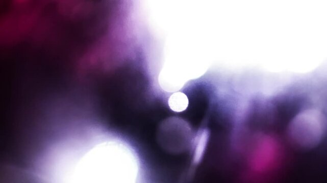 Vibrant pink and white multicolored light leaks burst overlays film light grain with high energy flashes on black background