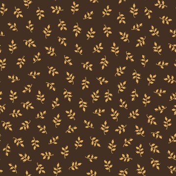 Golden botanical seamless pattern with simple leafy branches on dark brown background. Warm autumn design for textile, wallpaper and wrapping paper.