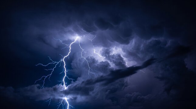 Powerful lightning bolt striking down through dark purple storm clouds with brilliant white blue electrical discharge