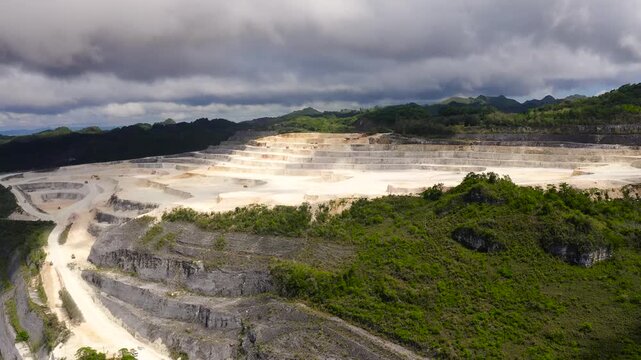Aerial drone of Limestone quarry for the construction industry in the mountains. Bohol, Philippines.