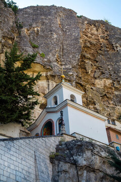 A church, a monastery in the rock on a clear, sunny day. Nature, landscape, world tourism.