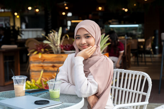 Portrait of Malaysian woman in a cafe
