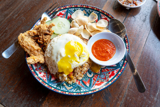 Close up of Nasi Goreng Kampung with egg and fried chicken