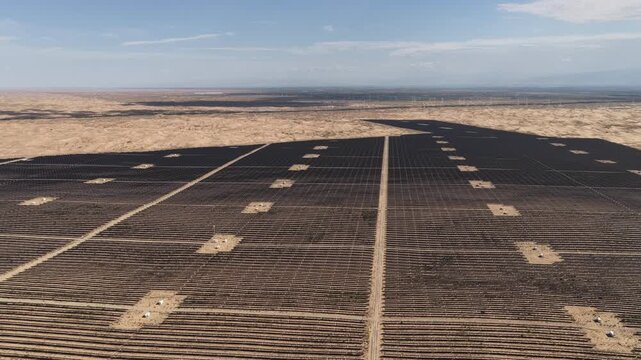 Aerial View of Utility-Scale Solar Farm with Battery Energy Storage System in Arid Desert
