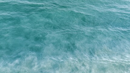 Fototapeta premium The Ocean Turquoise Waves along the Shore With Foamy White Surf