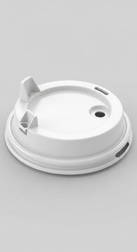 White disposable coffee cup lid with sipper hole and tab.