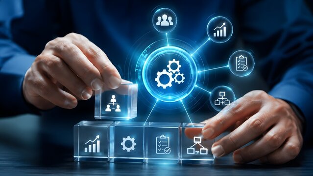 Business process automation concept with glowing icons and hand placing cube