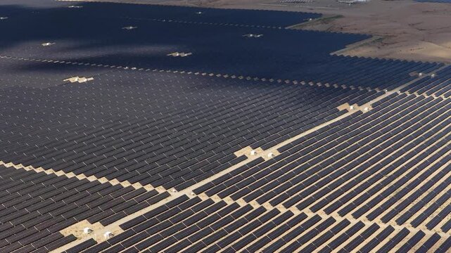 Aerial View of Utility-Scale Solar Farm with Battery Energy Storage System in Arid Desert
