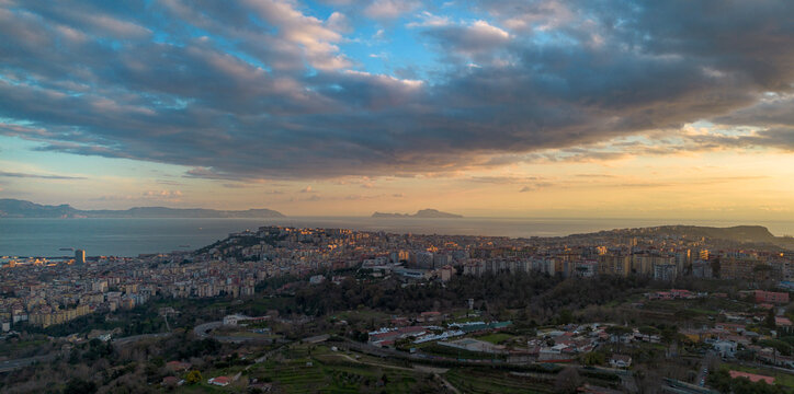 Panoramic sunset view of Naples and Capri from Campania, Italy