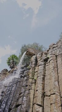 Water flowing down the spectacular basaltic prisms of santa maria regla in huasca, mexico