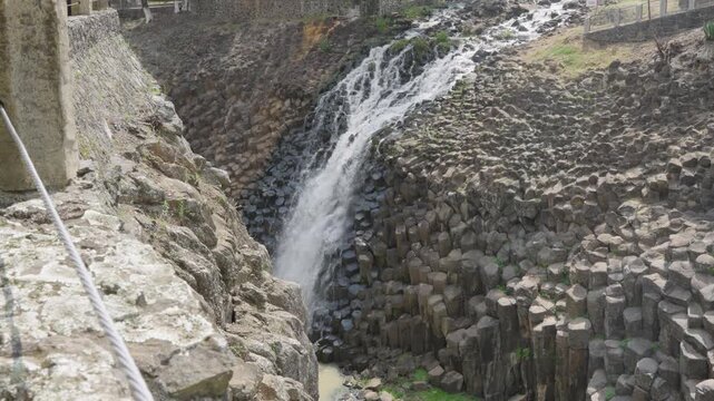 Beautiful waterfall cascading down the unique geological formation of basaltic prisms in hidalgo, mexico