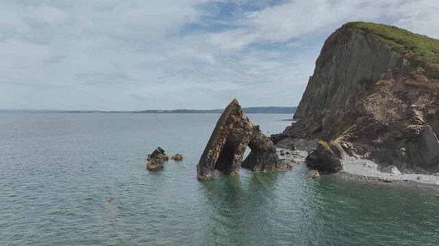 Blackchurch Rock and Cliffs over Mouthmill Beach from a drone, North Devon Coast, Devon, England