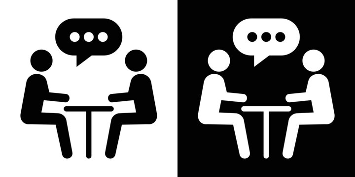Flat vector symbol of two stick figures seated at a table communicating with a chat bubble, representing a one-on-one discussion or client meeting.