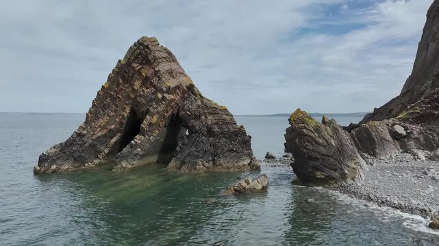 Blackchurch Rock and Cliffs over Mouthmill Beach from a drone, North Devon Coast, Devon, England
