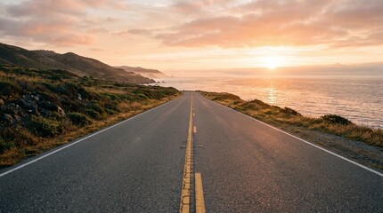 Fototapeta premium Scenic coastal highway stretching toward the horizon during a warm sunset