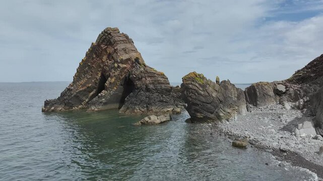 Blackchurch Rock and Cliffs over Mouthmill Beach from a drone, North Devon Coast, Devon, England