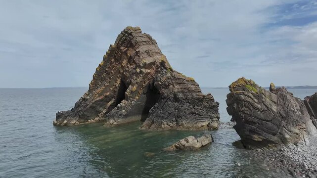 Blackchurch Rock and Cliffs over Mouthmill Beach from a drone, North Devon Coast, Devon, England