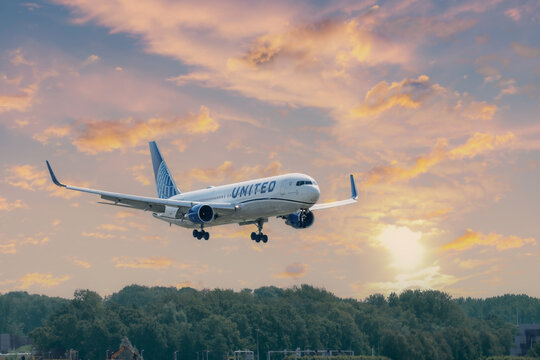 July 30, 2026. Netherlands, Amsterdam. United Airlines Plane Landing at Amsterdam Schiphol Sunset