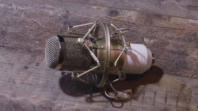 Setting up a studio microphone with anti vibration attachment for clear sound recording