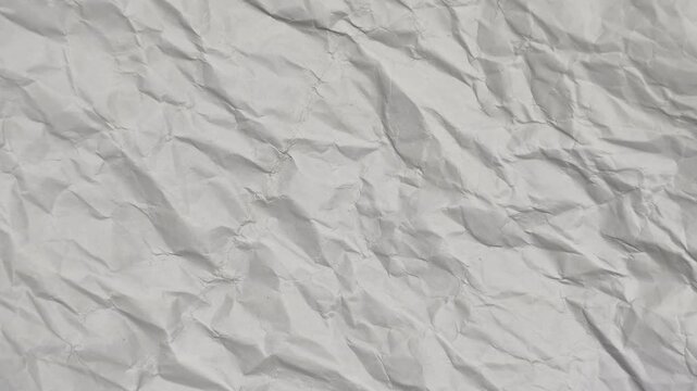 Animated crinkled white paper texture stop motion. Seamless looping. 4K Video