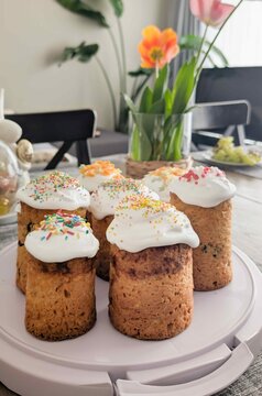 Baking event with Easter Cupcakes  and colorful frosting on a table surrounded by flowers and decor