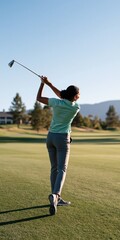 Obraz premium Female golfer follow through swing on green golf course background for banner and poster design