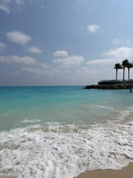 Turquoise Sea Waves on Sunny Tropical Beach