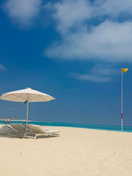 Tropical Beach with Umbrella and Turquoise Sea